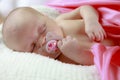 Sleeping baby with pacifier