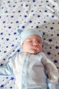 Sleeping baby. Peaceful baby lying on a bed while sleeping in a bright room Royalty Free Stock Photo