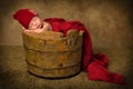 Sleeping baby in vintage bucket Royalty Free Stock Photo