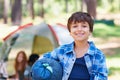 Sleeping bag, camping or portrait of happy kid in woods for adventure or holiday vacation in park. Relax, start or boy Royalty Free Stock Photo