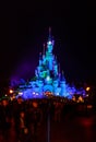 Sleeping Beauty Castle , the symbol of Disneyland Paris at night with a view of the main street Royalty Free Stock Photo