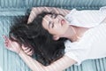 Sleeping beauty. Woman with long hair sleep on bench. Arabian woman relax with closed eyes, pure look. Total relaxation Royalty Free Stock Photo