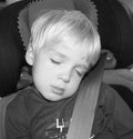 Sleeping Boy in Car Seat Royalty Free Stock Photo