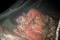 A sleeping boy inside a mosquito net,the safest and easiest way to prevent mosquitoes