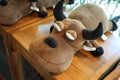 Sleeping brown Buffalo doll, Peace calm bull with black horn on wooden table Royalty Free Stock Photo