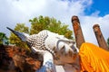 Sleeping Buddha Status at Wat Yai Chaimongkol, Ayutthaya, Thailand, with blue sky and white clouds behind Royalty Free Stock Photo