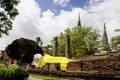 Sleeping Buddha Status at Wat Yai Chaimongkol, Ayutthaya, Thailand, with blue sky and white clouds behind Royalty Free Stock Photo