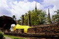 Sleeping Buddha Status at Wat Yai Chaimongkol, Ayutthaya, Thailand, with blue sky and white clouds behind Royalty Free Stock Photo