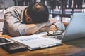 Sleeping Businessman, Tired senior businessman sleeping having long working day overworked on table in his office Royalty Free Stock Photo