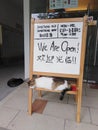 Sleeping cats and signboard