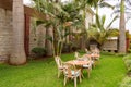 Sleeping corner with three iron chairs in a tropical garden in N Royalty Free Stock Photo