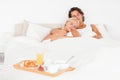 Sleeping couple with the breakfast Royalty Free Stock Photo