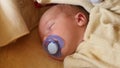 Sleeping cute newborn baby with papilla