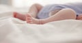 Sleeping, dreaming and feet of baby on bed for child care, resting and relax in nursery. Adorable, cute and closeup of Royalty Free Stock Photo