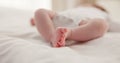 Sleeping, family and feet of baby on bed for child care, dreaming and relax in nursery. Adorable, cute and closeup of Royalty Free Stock Photo