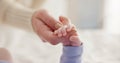 Sleeping, family and holding hands with baby on bed for bonding, love and relationship with infant. Adorable, care and Royalty Free Stock Photo