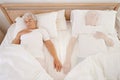 Sleeping, ghost and senior woman in bed, depression and mourning of husband or spouse in bedroom. Elderly female person Royalty Free Stock Photo