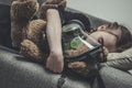 Sleeping Girl With Teddy Bear In Gas Mask Royalty Free Stock Photo