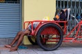 Sleeping homeless on old rickshaw in Bangkok