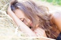 Sleeping lady on hay stack Royalty Free Stock Photo