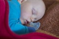 Sleeping baby with manifestations of an allergy on the face Royalty Free Stock Photo