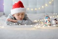 Sleeping little boy child in Santa Claus hat Royalty Free Stock Photo