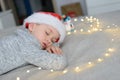 Sleeping little boy child in Santa Claus hat Royalty Free Stock Photo