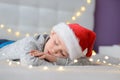 Sleeping little boy child in Santa Claus hat Royalty Free Stock Photo