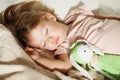 Sleeping little girl. Carefree sleep little baby with a soft toy Royalty Free Stock Photo