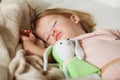 Sleeping little girl. Carefree sleep little baby with a soft toy Royalty Free Stock Photo