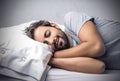 Sleeping man into bed Royalty Free Stock Photo