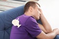 Sleeping man with paper fish attached to his back Royalty Free Stock Photo