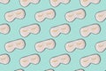 Sleeping mask pattern. Pink silk sleeping masks for eyes on pastel blue background. Creative Top view Flat lay Royalty Free Stock Photo