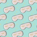 Sleeping mask pattern. Pink silk sleeping masks for eyes on pastel blue background. Creative Top view Flat lay. Royalty Free Stock Photo