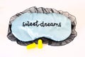 Sleep mask on white Sweet dreams ear plugs Royalty Free Stock Photo