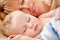 Sleeping, mom and calm baby in bed together with peace, happiness and love for infant in morning nap. Mother, cuddle and
