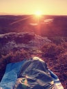 Sleeping in nature in sleeping bag. Beautiful awakening in rocks. View from rocky peak Royalty Free Stock Photo