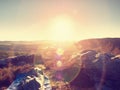 Sleeping in nature in sleeping bag. Beautiful awakening in rocks. View from rocky peak