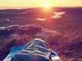 Sleeping in nature in sleeping bag. Beautiful awakening in rocks. View from rocky peak Royalty Free Stock Photo