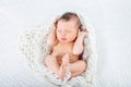 Sleeping newborn baby boy lies  in a knite plaid Royalty Free Stock Photo