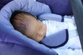 Newborn baby boy in safety car seat Royalty Free Stock Photo