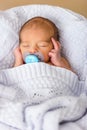 Sleeping newborn baby boy with pacifier. Babyface close-up Royalty Free Stock Photo