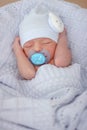 Sleeping newborn baby boy with pacifier. Babyface close-up Royalty Free Stock Photo