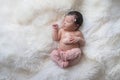 Sleeping Newborn Baby Girl with Heart Shaped Pillow