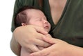 Sleeping newborn baby in the hands of her mother Royalty Free Stock Photo