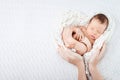 Sleeping newborn baby  in mother hands - hearth shape Royalty Free Stock Photo