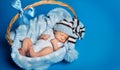 Sleeping Newborn Baby, New Born Kid sleep in Basket, Studio Portrait on Blue Royalty Free Stock Photo