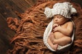 Sleeping Newborn Baby, New Born Kid sleep in Hat, Studio Portrait on Brown Royalty Free Stock Photo