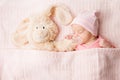 Sleeping Newborn Baby with Toy, New Born Kid Sleep covered by Blanket, Child Portrait Royalty Free Stock Photo