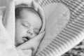 Sleeping newborn baby wrapped in a blanket on the hammock chair. Sweet dreams concept Royalty Free Stock Photo